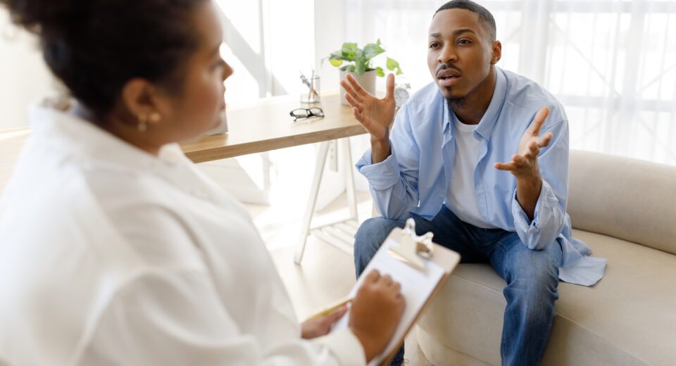 Anxious black man experiencing midlife crisis, have therapy session