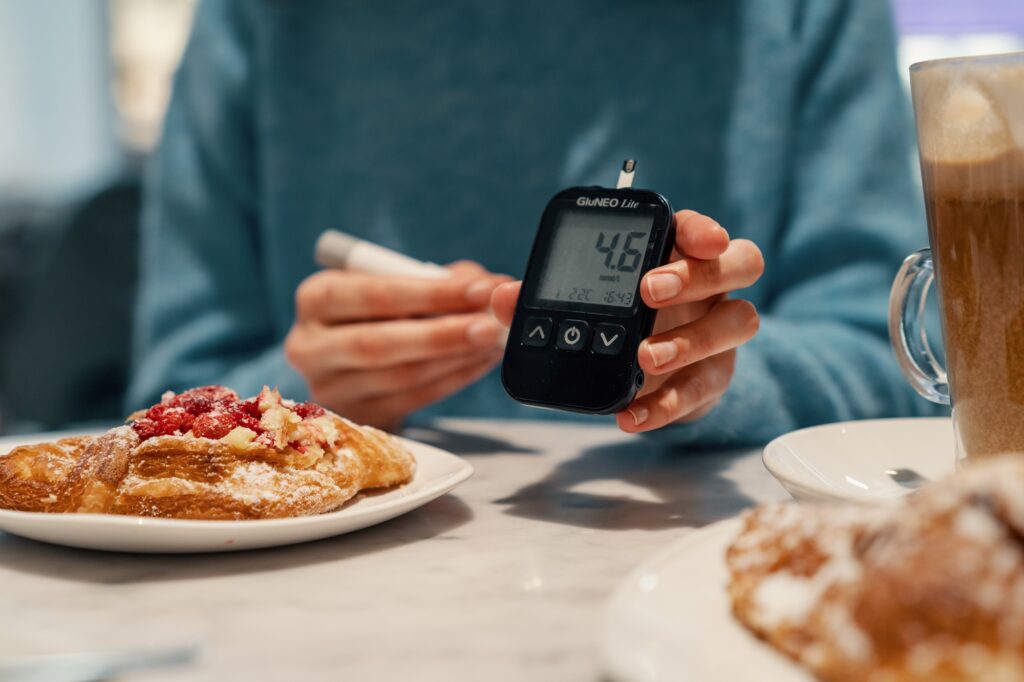 Diabetic woman measuring normal sugar level. Preparing yourself for meals
