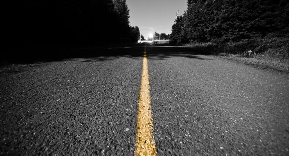 Empty road with Yellow Dividing line at Night