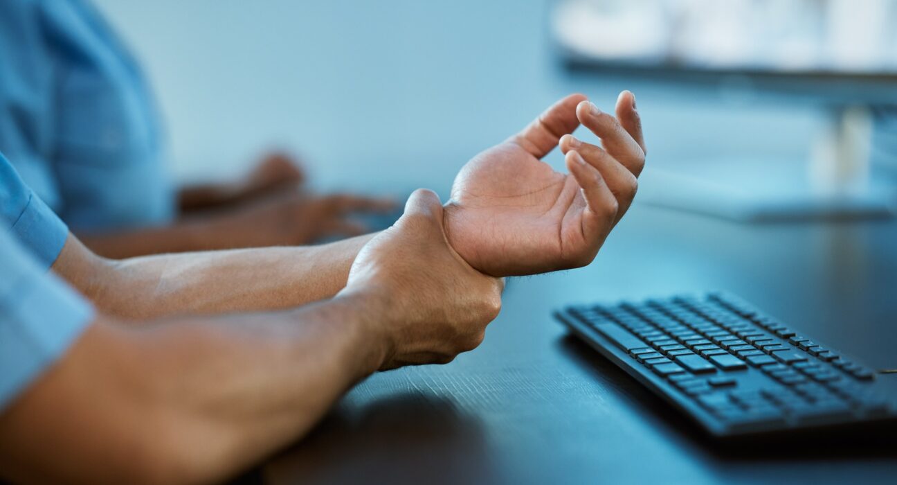 Person, hands and wrist pain in surveillance from injury, accident or carpal tunnel syndrome at off