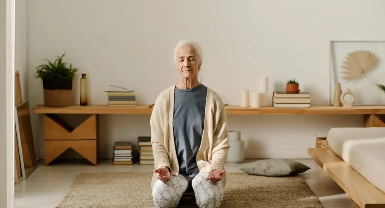 Aged woman practicing yoga exercise