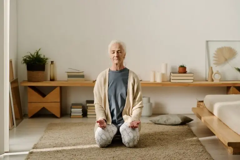 Aged woman practicing yoga exercise