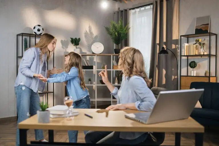 Caucasian female worker sitting at table with opened laptop, trying to reconcile her girls .