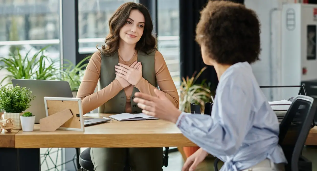 Colleagues Engage in Meaningful Conversation During Layoff Discussions at Office