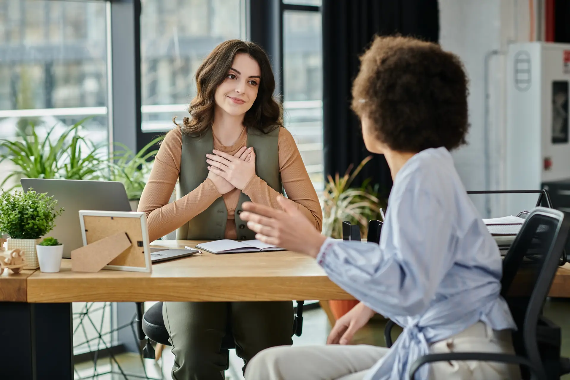 Colleagues Engage in Meaningful Conversation During Layoff Discussions at Office