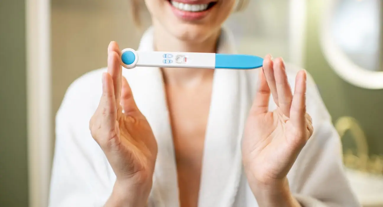 Holding pregnancy test stick