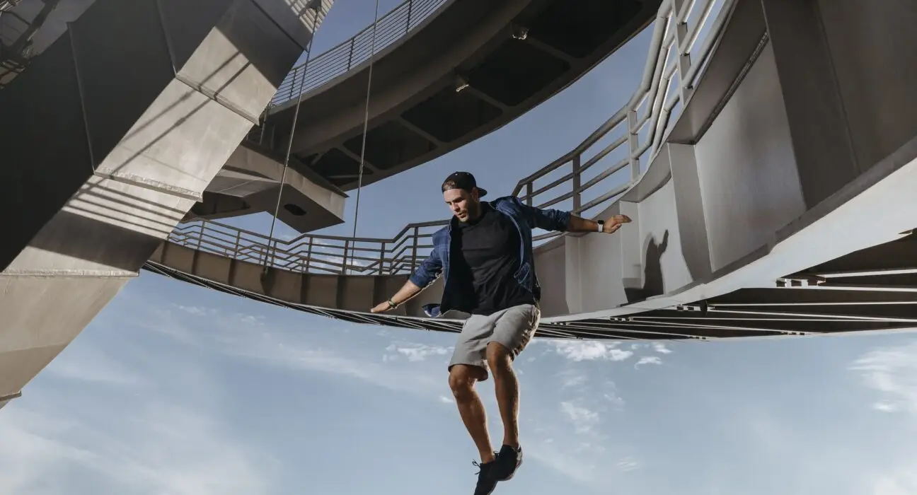 Huge and risky jump from a bridge performed by parkour athlete