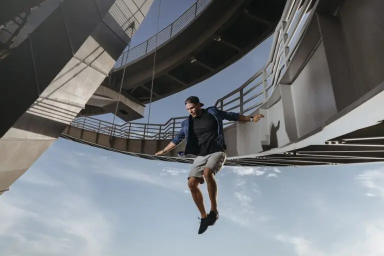 Huge and risky jump from a bridge performed by parkour athlete