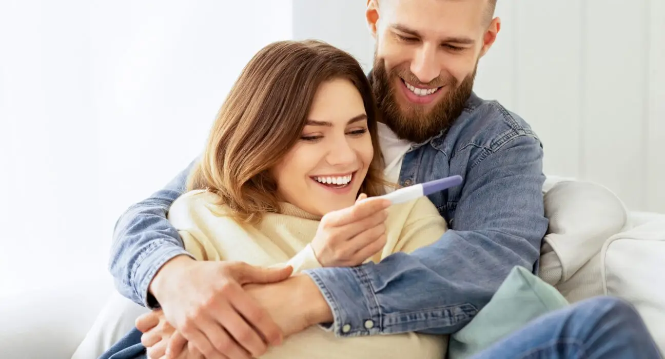 I'm Pregnant! Happy Couple Checking Pregnancy Test