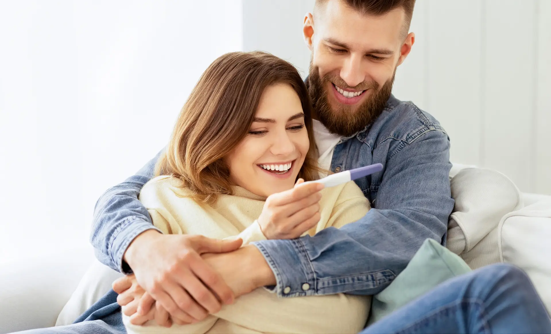 I'm Pregnant! Happy Couple Checking Pregnancy Test