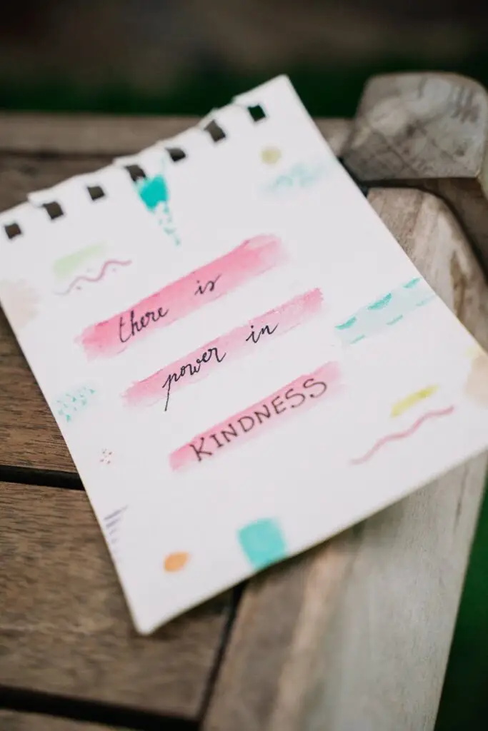 white paper with message on a wooden table