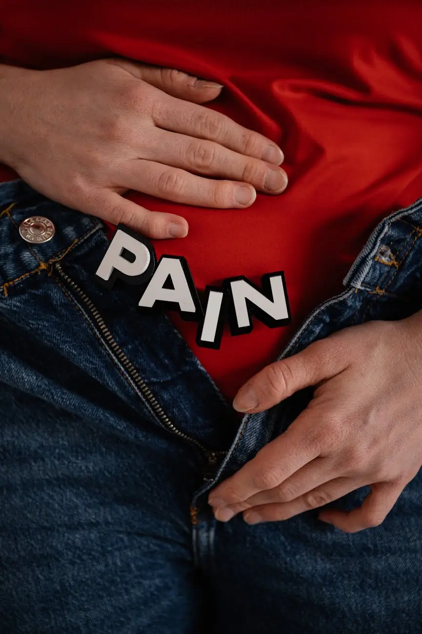 person wearing red top and denim bottoms